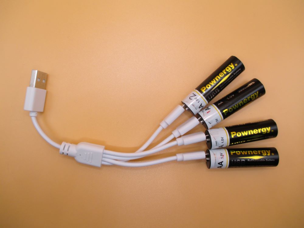 Pownergy AA Li-Ion batteries shown here with micro-USB charging adapter